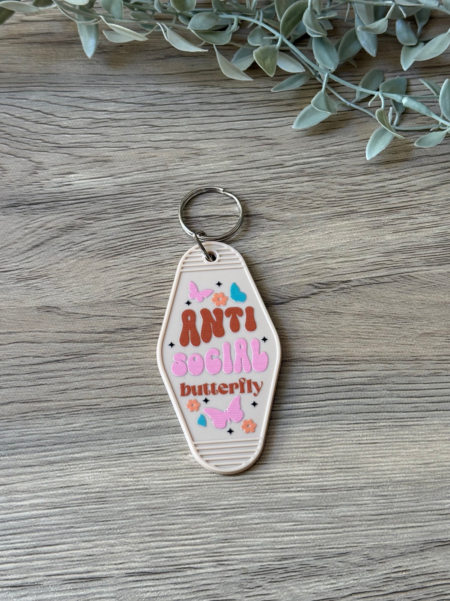 anti social butterfly motel keychain
