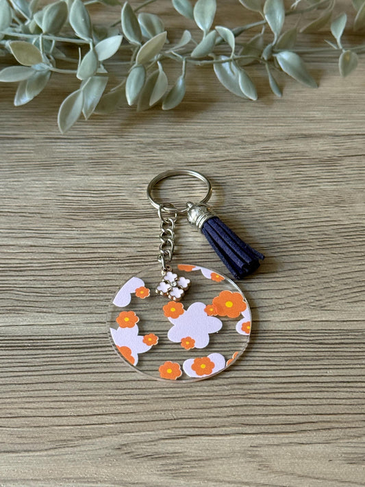 orange and pink flower round keychain with tassel & charm