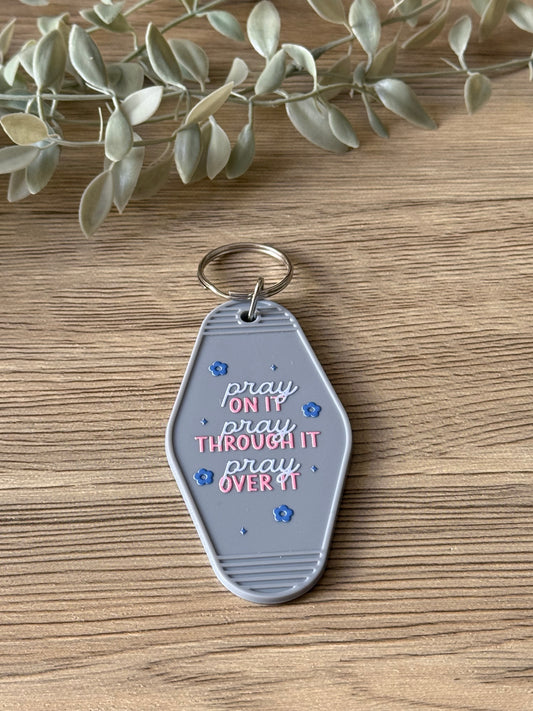 pray motel keychain