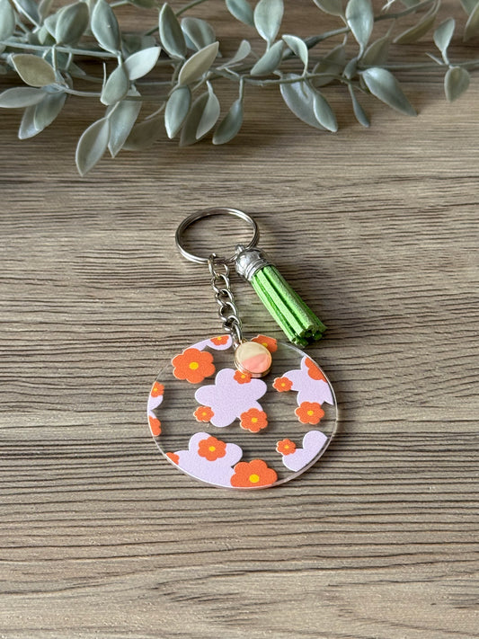 orange and pink flower round keychain with tassel & charm