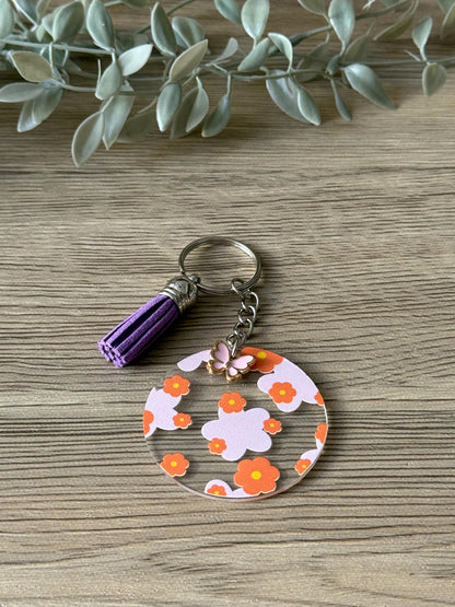 orange and pink flower round keychain with tassel & charm